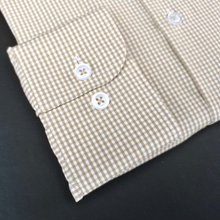a close up of a dress shirt on a table