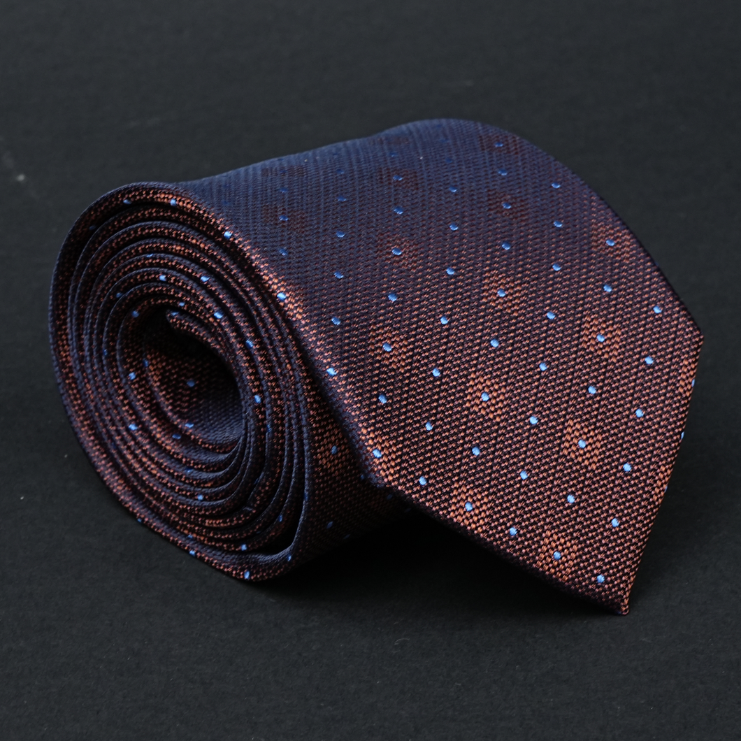 a close up of a tie on a black surface