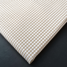 a close up of a checkered cloth on a table