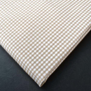 a close up of a checkered cloth on a table