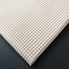 a close up of a checkered cloth on a table
