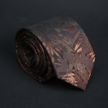 a close up of a tie on a black surface