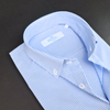 a blue and white checkered shirt on a black surface