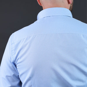 a man with a bald head wearing a blue shirt