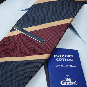 a close up of a tie and a passport
