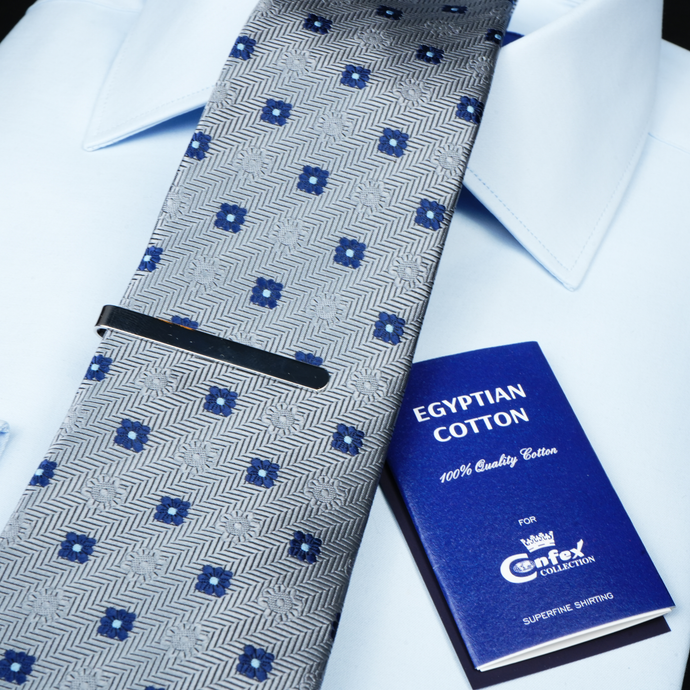 a close up of a tie and a book