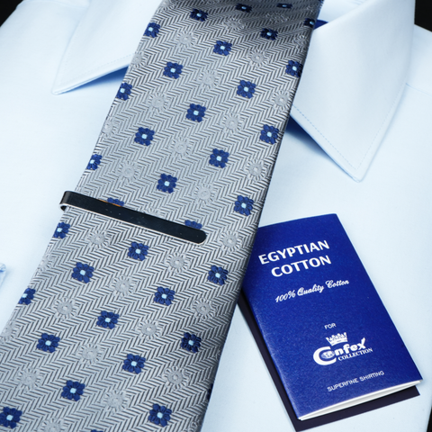 a close up of a tie and a book
