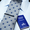 a close up of a tie and a book