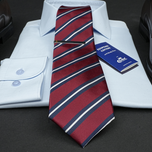 a red and blue striped tie and a white shirt