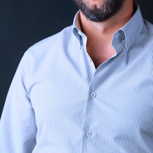 a man with a beard wearing a blue shirt