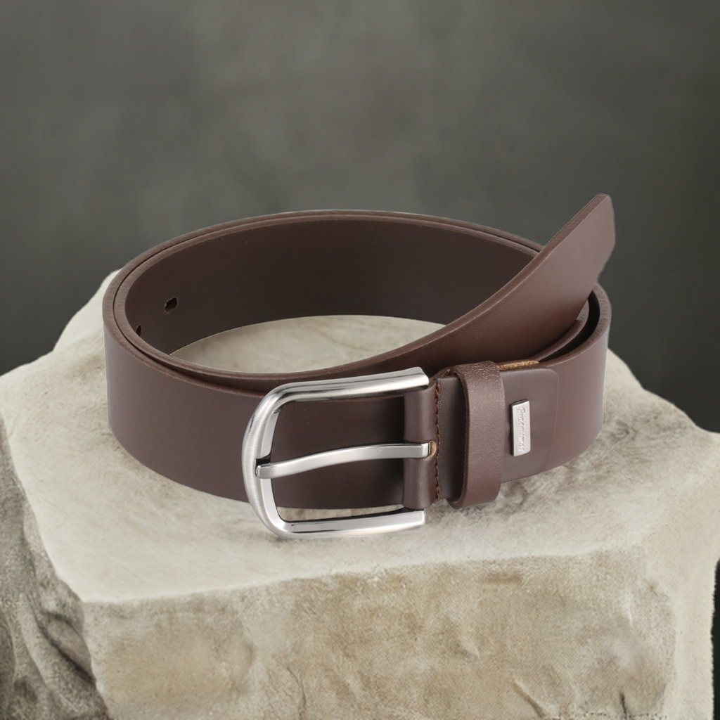 a brown belt sitting on top of a rock