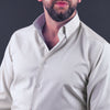 a man with a beard wearing a dress shirt