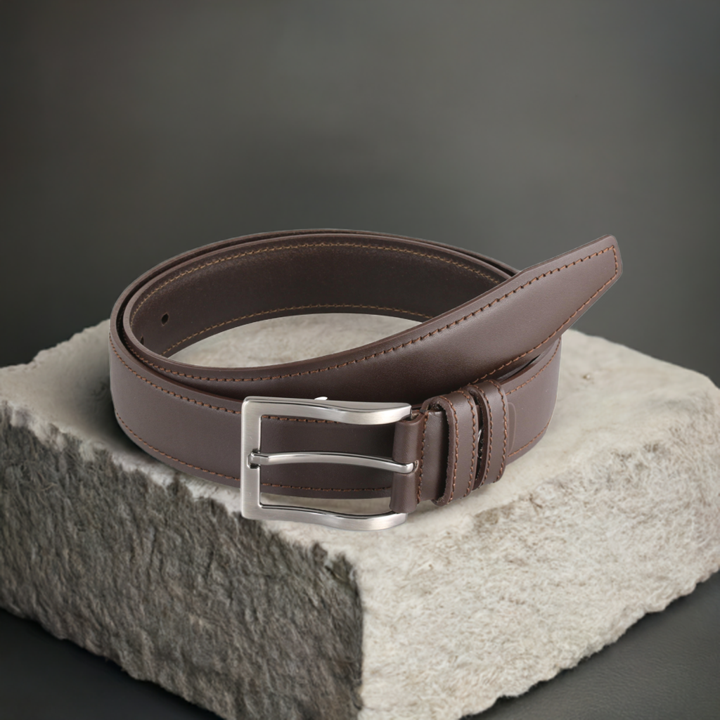 a brown belt sitting on top of a stone block