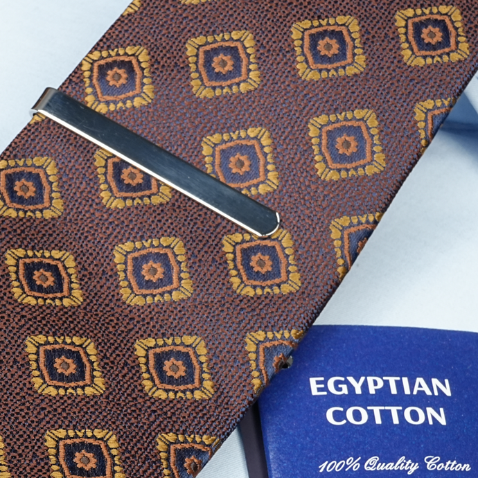 a close up of a tie and a book