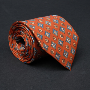 a close up of a tie on a black surface