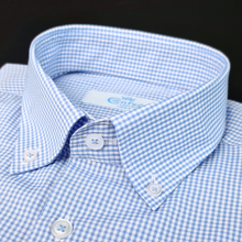a close up of a blue and white checkered shirt