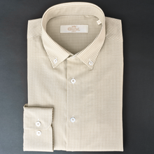 a white shirt with a black and white checkered pattern