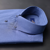 a blue and white checkered shirt sitting on top of a table