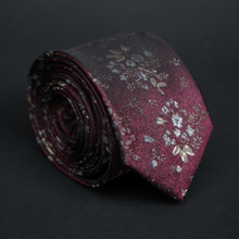 a close up of a tie on a black background