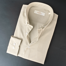 a white shirt with a black and white checkered pattern