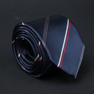 a close up of a tie on a black surface