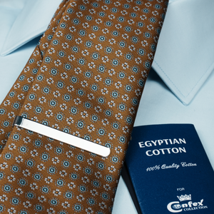a close up of a tie and a passport