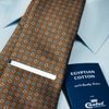 a close up of a tie and a passport
