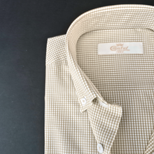 a close up of a shirt on a black surface
