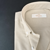 a close up of a shirt on a black surface