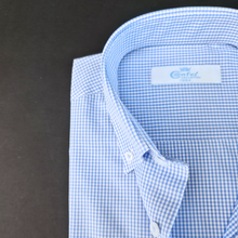a close up of a blue and white checkered shirt