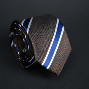 a close up of a tie on a black surface