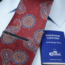 a red tie with a blue book on it