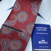 a red tie with a blue book on it
