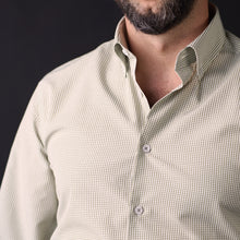 a man with a beard wearing a shirt